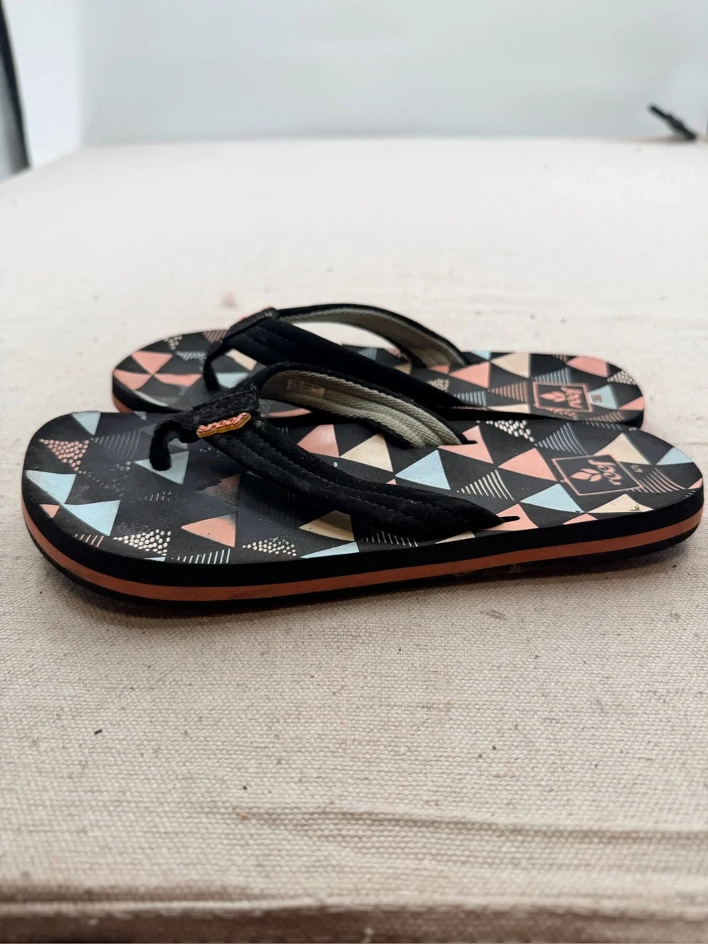 Reef Black Flip Flops with Coral & Light Blue Triangle Print